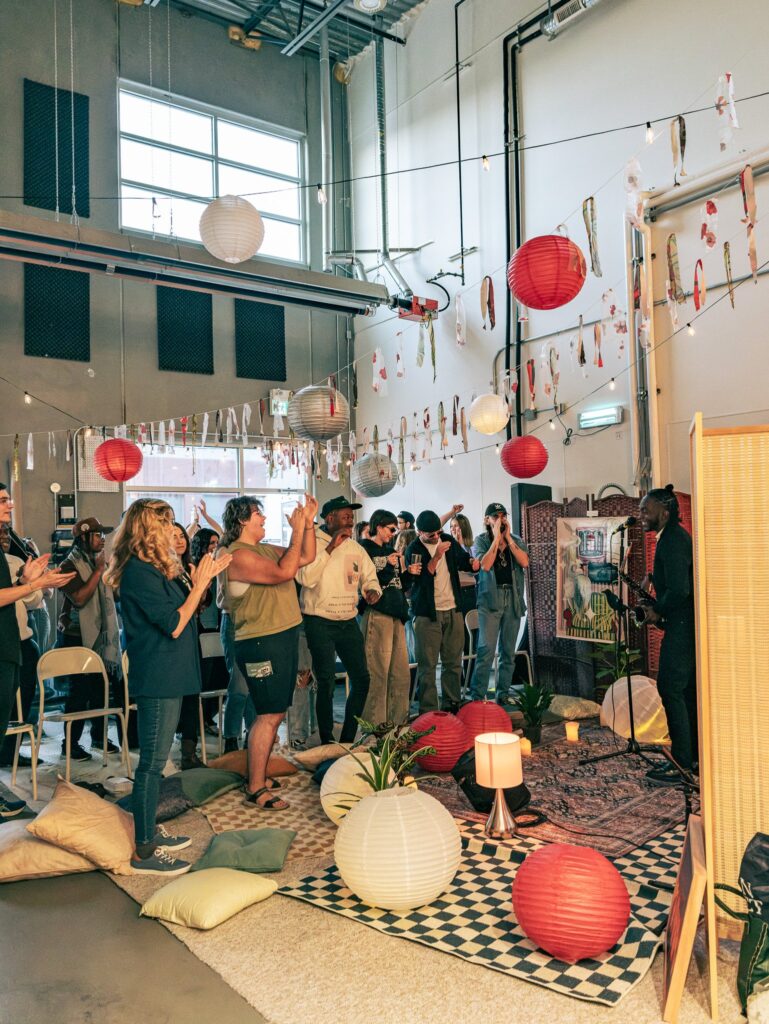 Guests applauding at the end of a live saxophone set